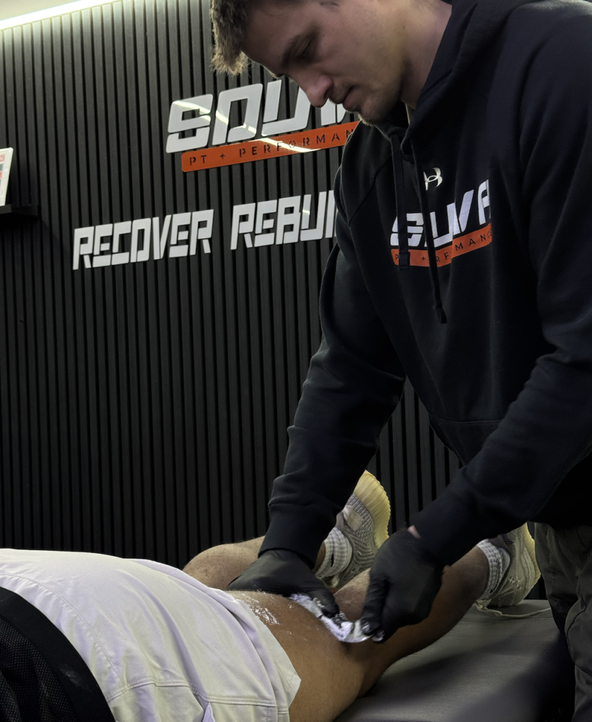 Cupping performed on an athlete to help improve mobility at a physical therapy session