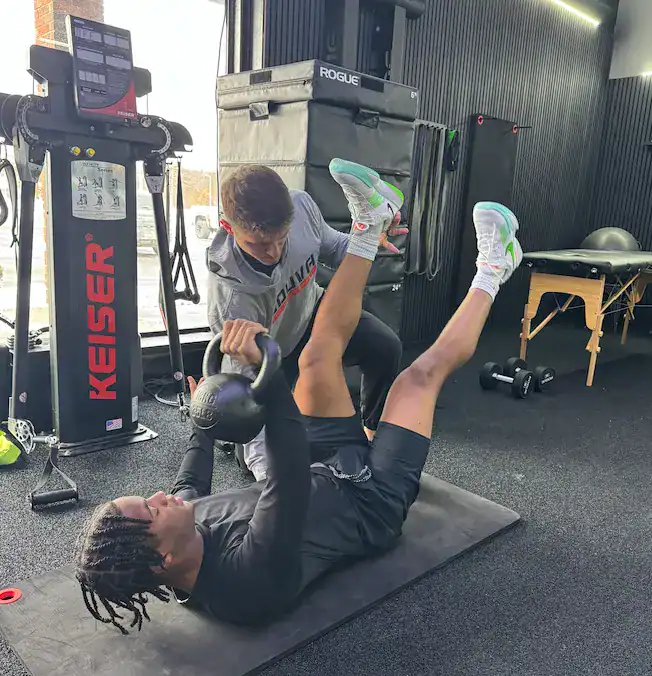 Sports physical therapist working with an athlete at Souva PT & Performance